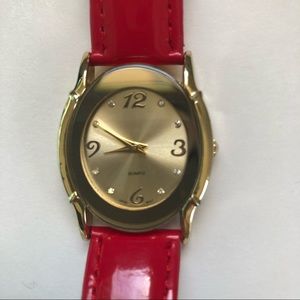 AVON gold and red watch.